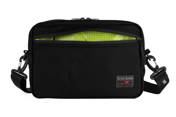 The Side Hustle in Black Ballistic with Kiwi (bright green) 200 Halcyon interior.